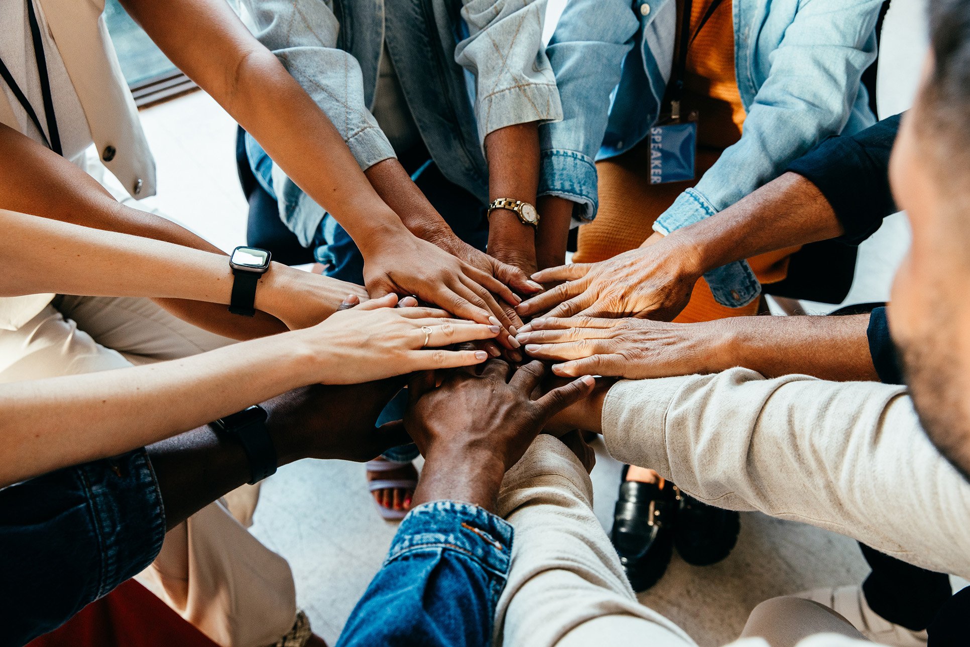 hands together in team huddle