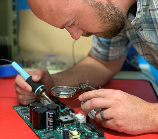 MERA technician repairing equipment