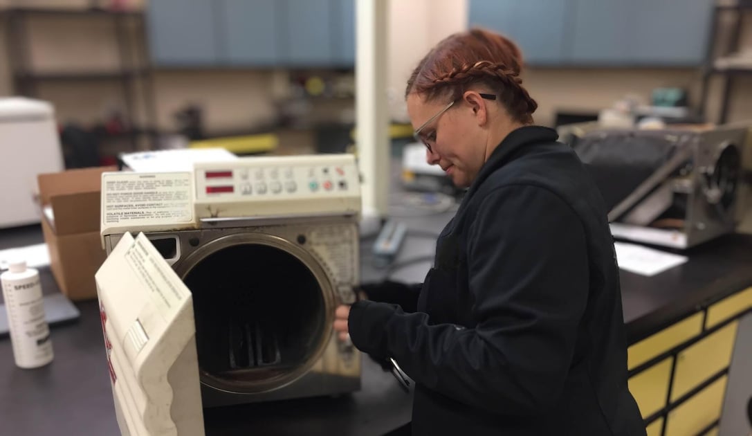 MERA technician repairing equipment