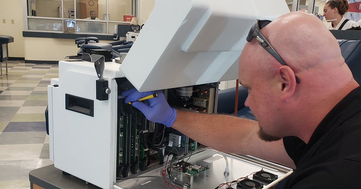 MERA technician repairing equipment